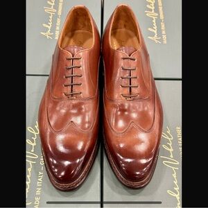 Brown elegant men’s oxford leather wingtip dress shoe with Norwegian stitching